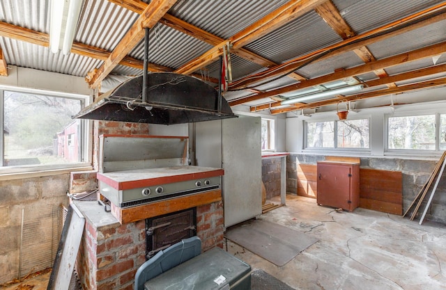 misc room with unfinished concrete flooring