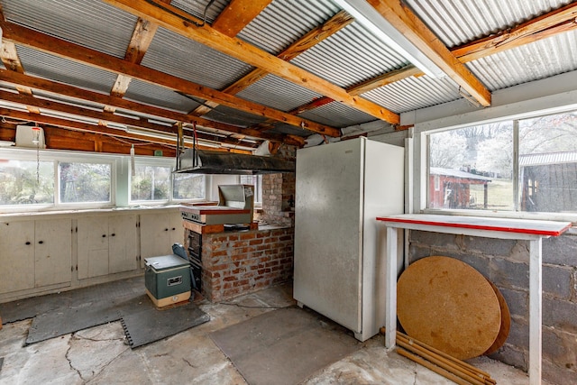 interior space featuring unfinished concrete flooring