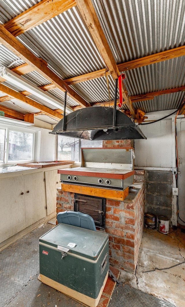 garage featuring a workshop area and a wood stove