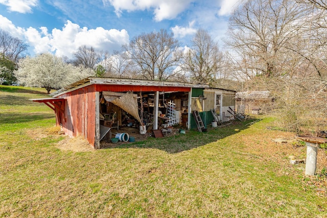 view of pole building with a yard