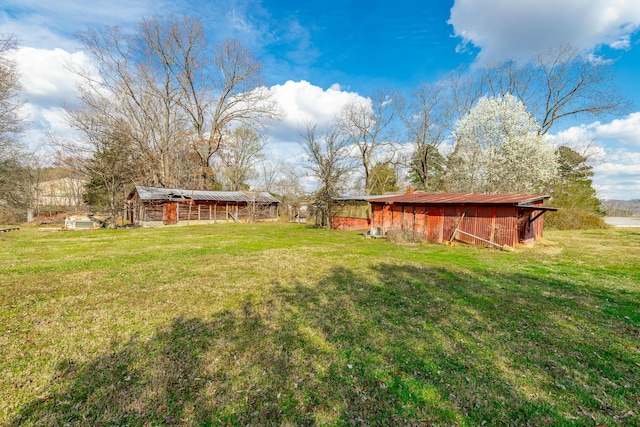 view of yard featuring an outbuilding and a pole building
