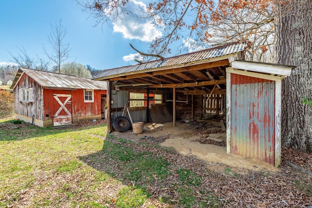 view of pole building with a lawn and a carport