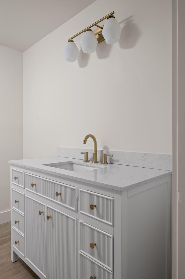 bathroom featuring a sink and wood finished floors