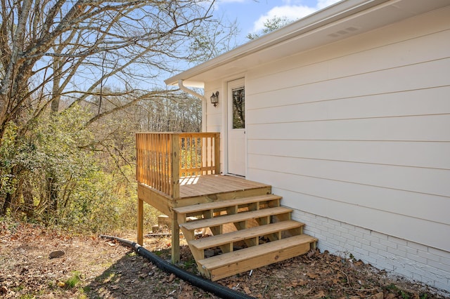 property entrance with a deck