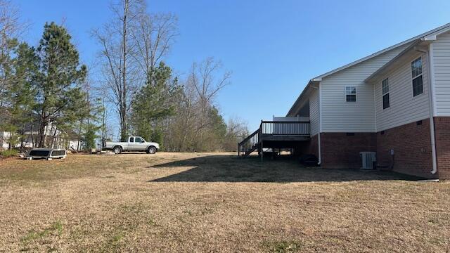 view of yard with a wooden deck