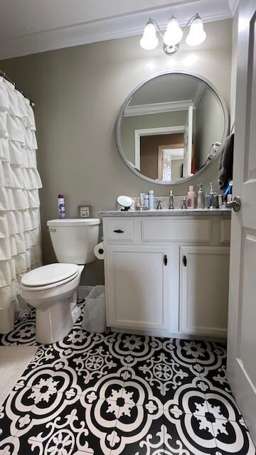 full bath with tile patterned floors, a shower with curtain, toilet, ornamental molding, and vanity