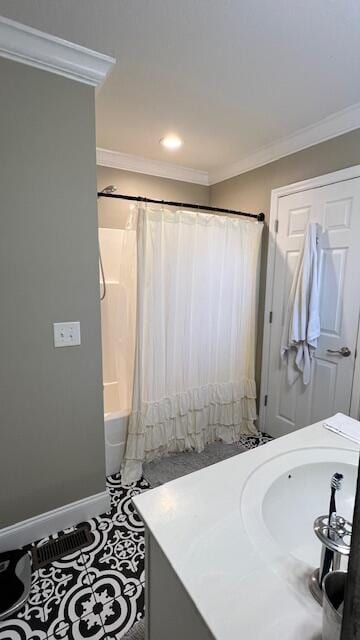 full bath with tile patterned flooring, baseboards, shower / tub combo with curtain, ornamental molding, and vanity