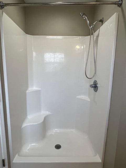 full bath featuring a shower