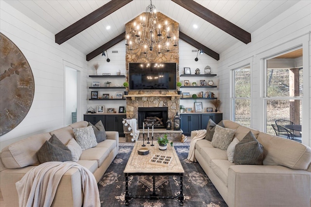 living area with beam ceiling, high vaulted ceiling, a stone fireplace, and wood walls