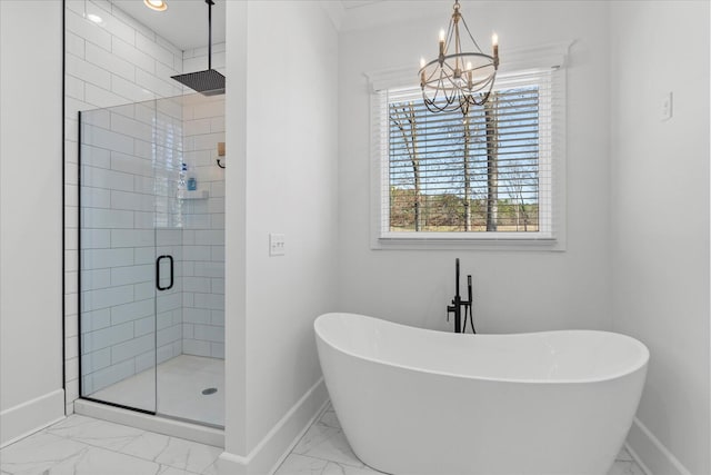 full bathroom featuring marble finish floor, a shower stall, baseboards, and a freestanding tub