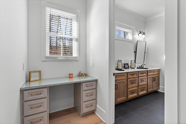 bathroom with vanity, baseboards, and ornamental molding