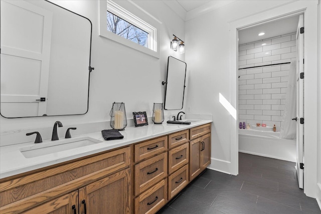 full bathroom featuring tile patterned flooring, double vanity, shower / washtub combination, and a sink