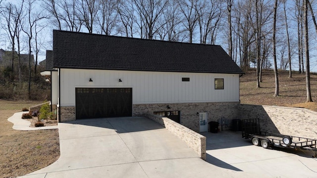 exterior space with concrete driveway