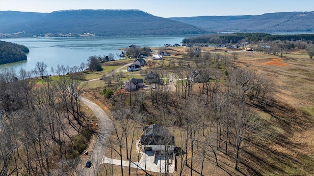 drone / aerial view with a water and mountain view