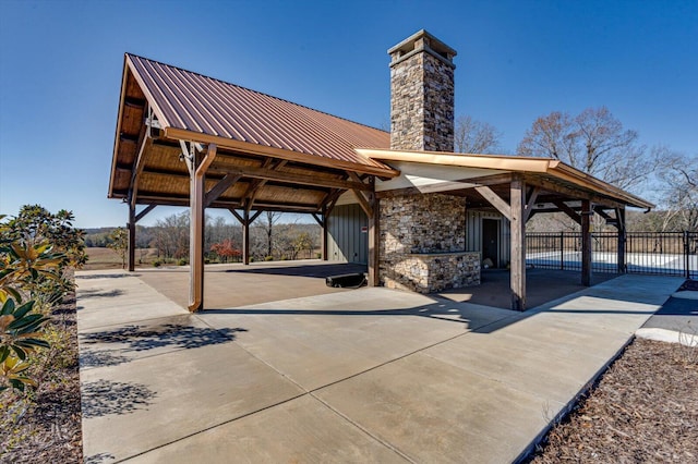 view of home's community featuring a gate and fence