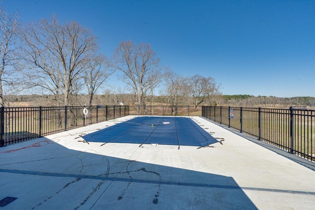 view of pool featuring a patio area, fence, and a fenced in pool