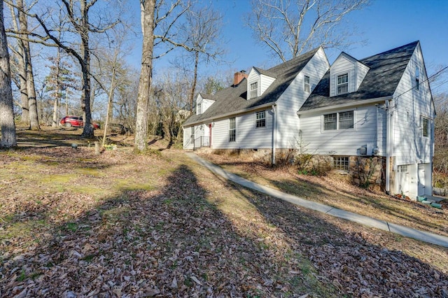 view of home's exterior with a chimney