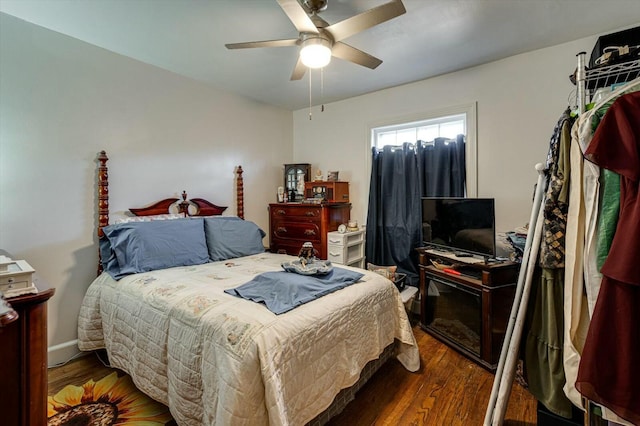 bedroom with wood finished floors and a ceiling fan