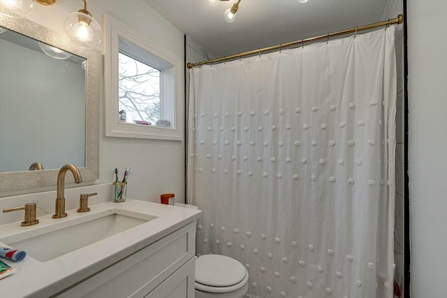 bathroom with a shower with shower curtain, toilet, and vanity