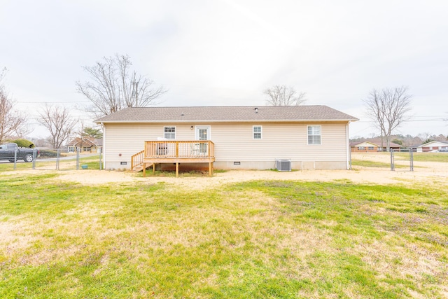 rear view of property featuring a lawn, a deck, fence, crawl space, and central AC unit