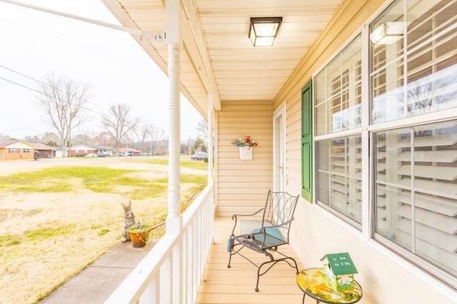 balcony featuring a porch