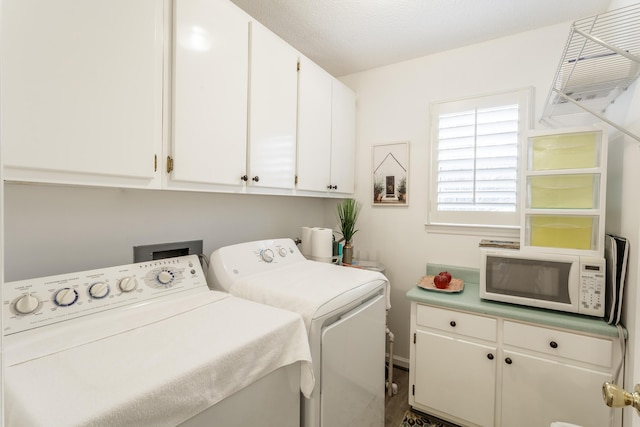 laundry room with cabinet space and independent washer and dryer