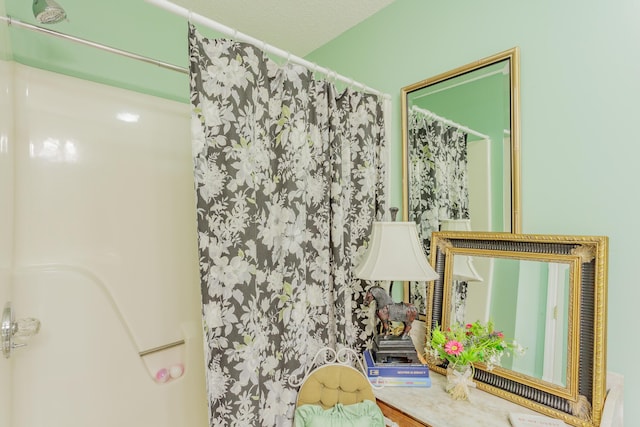 bathroom with a shower with shower curtain