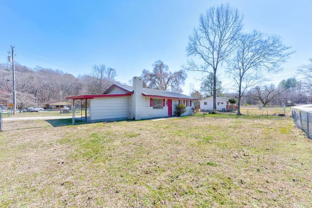 view of front of property with metal roof, a chimney, a front yard, and fence