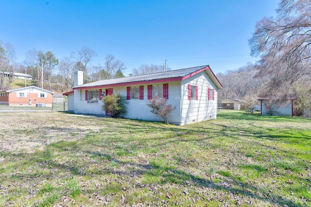 single story home with a front lawn, a chimney, and crawl space