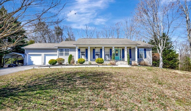 ranch-style home with driveway, a front lawn, covered porch, a garage, and a carport