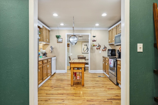 kitchen featuring baseboards, stainless steel appliances, light wood-style floors, pendant lighting, and crown molding