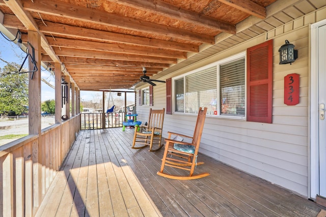 wooden deck with a ceiling fan and covered porch