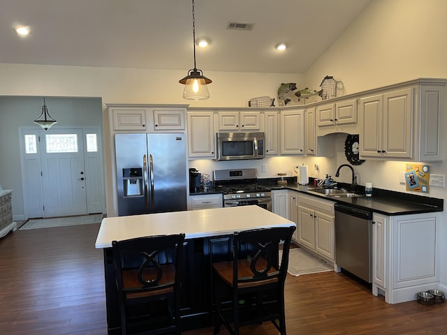 kitchen featuring dark wood-style floors, visible vents, appliances with stainless steel finishes, and a sink