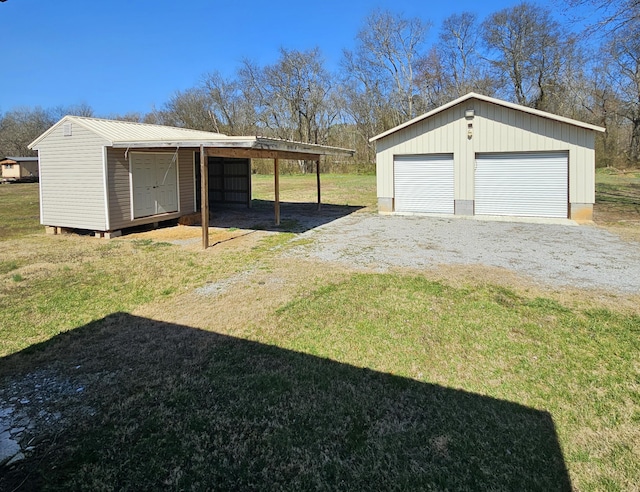 view of yard with an outbuilding and a detached garage