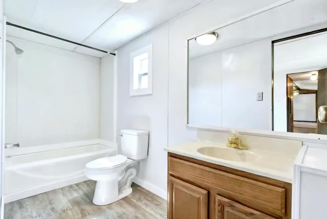 full bath with wood finished floors, toilet, bathtub / shower combination, and vanity