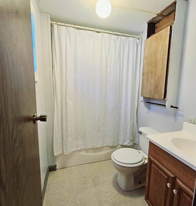 full bath with vanity, toilet, and shower / bath combo with shower curtain