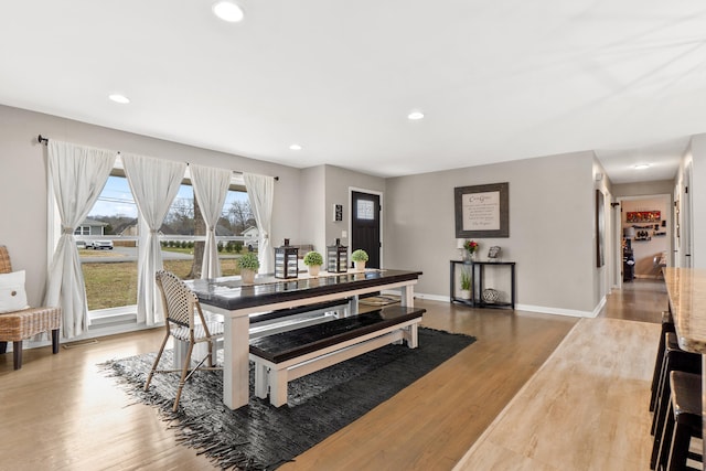 dining room featuring recessed lighting, baseboards, and wood finished floors