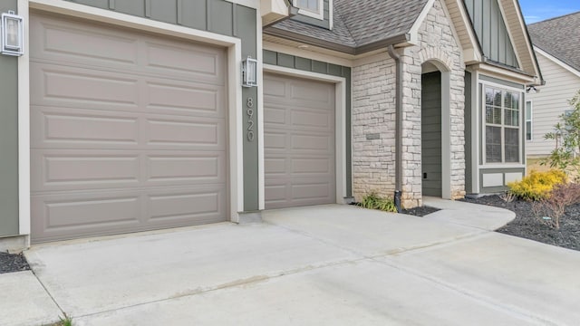 garage featuring concrete driveway