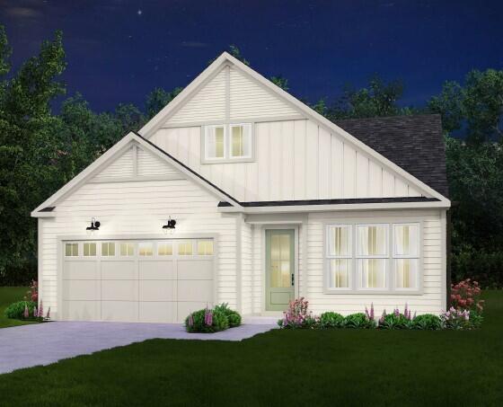 view of front facade with an attached garage, concrete driveway, board and batten siding, and a front yard