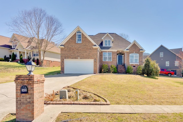 traditional-style house featuring brick siding, an attached garage, concrete driveway, and a front yard