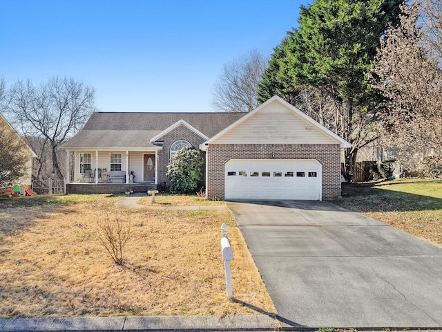 ranch-style home with brick siding, an attached garage, a front lawn, covered porch, and driveway