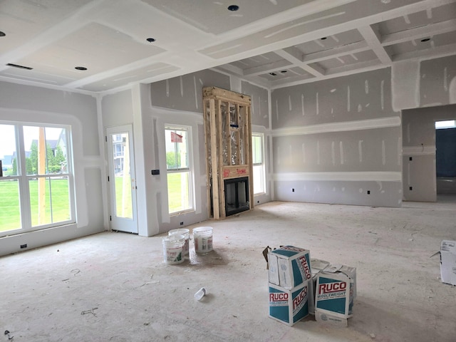 unfurnished living room with a healthy amount of sunlight and a fireplace
