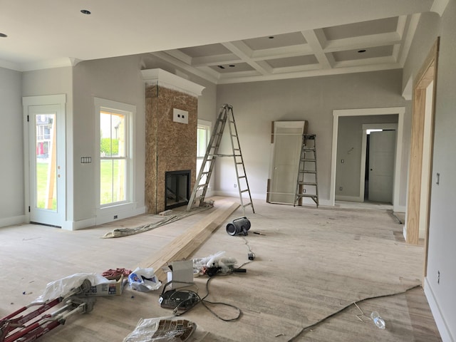 12800 Blakeslee Dr Unit 22, Soddy Daisy, TN 37379 - unfurnished living room featuring a large fireplace, coffered ceiling, beamed ceiling, and ornamental molding