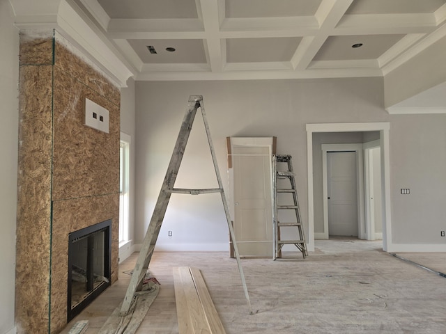 12800 Blakeslee Dr Unit 22, Soddy Daisy, TN 37379 - unfurnished living room featuring coffered ceiling, a tiled fireplace, beam ceiling, and crown molding