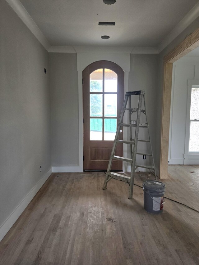 12800 Blakeslee Dr Unit 22, Soddy Daisy, TN 37379 - empty room with arched walkways, wood finished floors, healthy amount of natural light, and crown molding