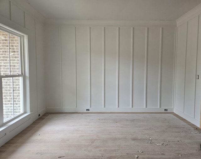 12800 Blakeslee Dr Unit 22, Soddy Daisy, TN 37379 - unfurnished room with a decorative wall and light wood-type flooring