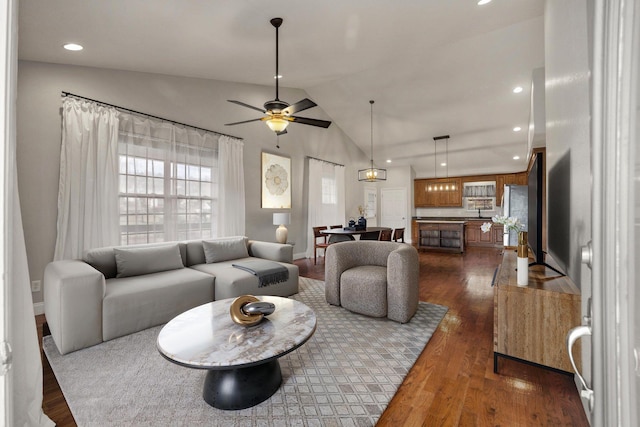 living area featuring recessed lighting, lofted ceiling, dark wood-type flooring, and ceiling fan