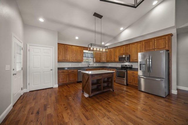 kitchen featuring open shelves, dark countertops, appliances with stainless steel finishes, brown cabinetry, and vaulted ceiling