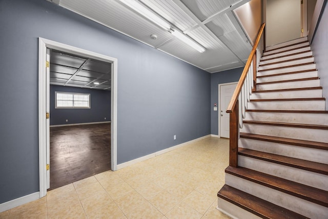 stairs featuring baseboards