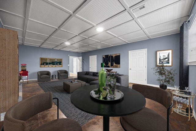 living room with visible vents and baseboards